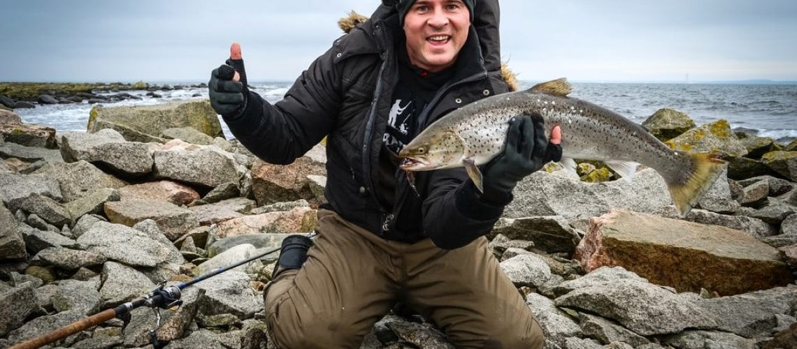 Man enjoy sea trout winter fishing
